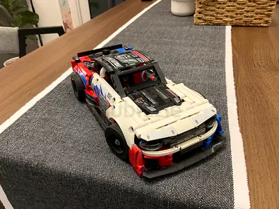 Manual buildable toy race car - used LEGO-style model