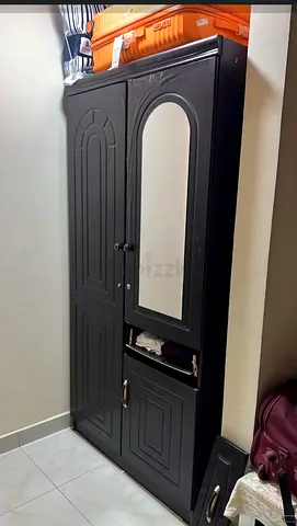 Stylish black wardrobe with mirror