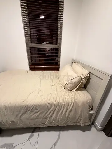 Single bed with mattress and sheets