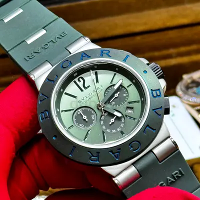 This is a BVLGARI Aluminium Smeraldo Special Edition featuring a distinctive green dial and a rubber