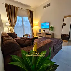 Two-bedroom apartment with a living room, newly furnished, for monthly rent in Ajman - Corniche - be