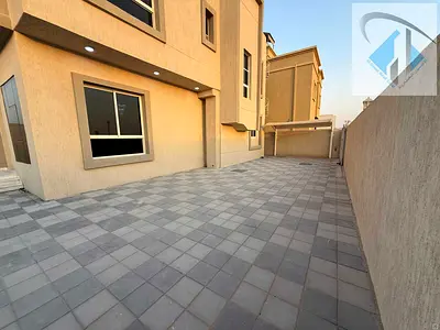For annual rent: 5-bedroom villa with a large yard and a shaded area.