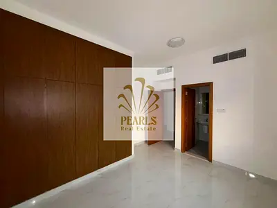 Luxury one-bedroom apartment for annual rent in Ajman. Features include: 2 bathrooms, balcony, luxurious kitchen, open view, deluxe finishes, spacious
