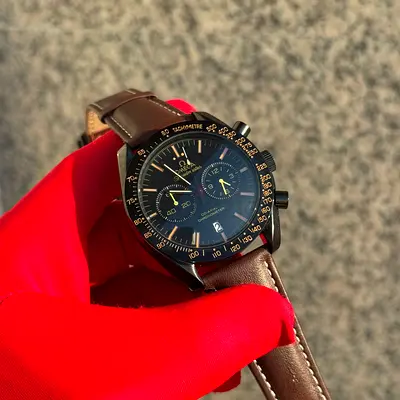 This Omega Speedmaster Dark Side of the Moon features a 44.25mm black ceramic case and a brown leath