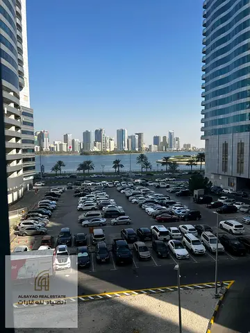 For Sale in Sharjah – Al Majaz 3 Apartment with 3 Bedrooms, a Living Room, a Balcony, 3 Bathrooms, and a Parking Space