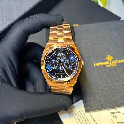 This is a Vacheron Constantin Overseas Perpetual Calendar Ultra-Thin in 18k pink gold with a distinc