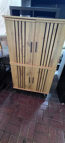 Solid wood freestanding cabinet / wardrobe with slatted doors