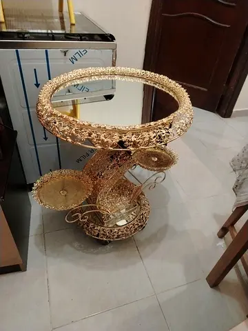 Luxury Gold Metal Spiral Serving Trolley Cart, an ornate multi-tiered rolling bar cart widely used f