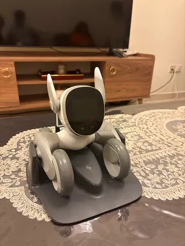 Small interactive robot pet toy with charging dock