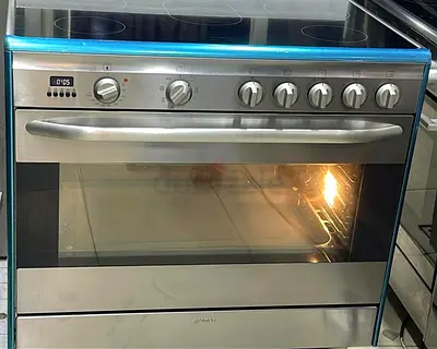 Stainless Steel Electric Range with Glass Ceramic Hob and Large Oven - Good Condition