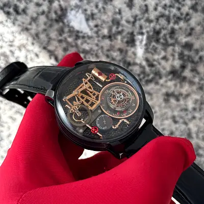 his watch is a Jacob & Co. Oil Pump, featuring a detailed automaton of an oil derrick inside a 43mm