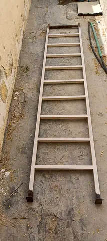 Metal straight ladder — sturdy single-section ladder, good condition
