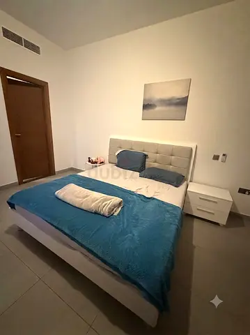 King bed with mattress and bedside tables
