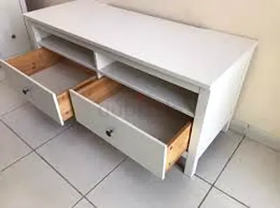The white IKEA HEMNES TV bench