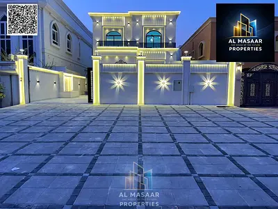 Luxury residential/commercial villa in Al Muwaihat 1, priced inclusive of electricity, water, and air conditioning, with an external majlis and a 20-m