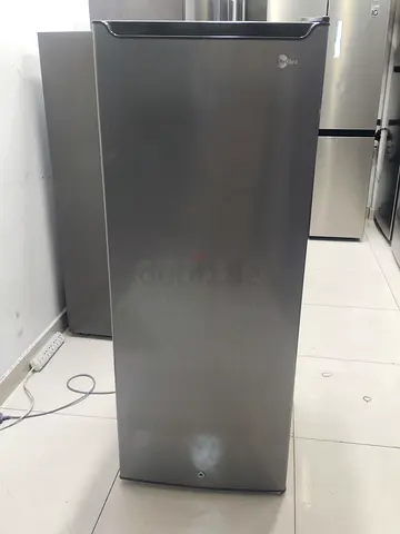 Single-door upright freezer / fridge in good condition - stainless finish