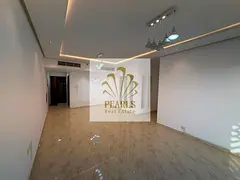 Luxury three-bedroom apartment with a living room for annual rent in Ajman. Features include two bat