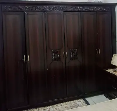 Large Dark Wood 6-Door Wardrobe with Carved Details