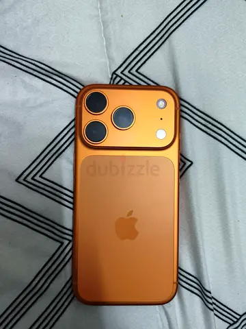 iPhone (orange/gold) with triple camera - good condition