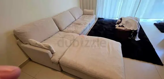 Brand new condition Home centre swin feather filled sofa with footstool