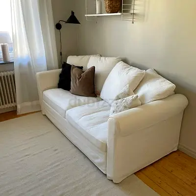 Comfortable 3-seater white fabric sofa bed good condition