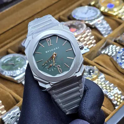 This Bulgari Octo Finissimo watch features a distinct green dial and a monochromatic titanium case a