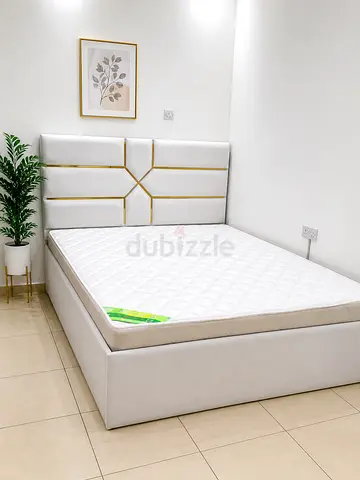 New White upholstered double bed frame with mattress - modern headboard