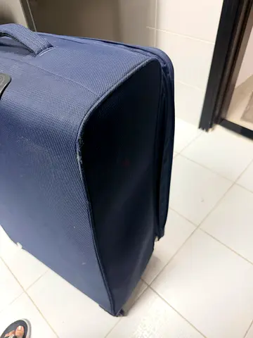 Navy soft-sided roller travel bag - good condition