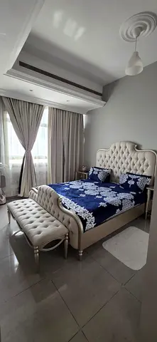 king-size bed with mirrored bedside tables and dressing table