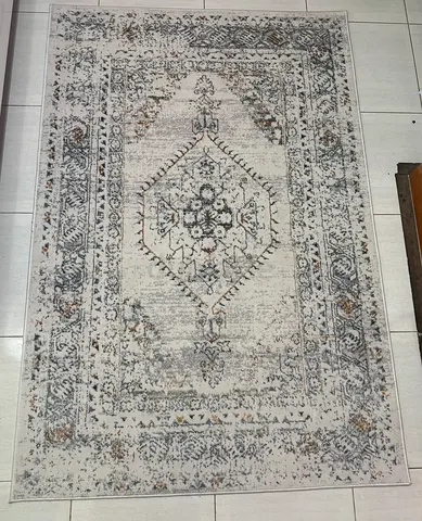 Vintage-style area rug - neutral tones, good condition