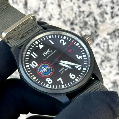 This IWC Pilot's Watch Mark XVIII Top Gun Edition "SFTI" features a black ceramic case and a promine
