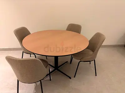 Round dining table with 4 upholstered chairs - good condition