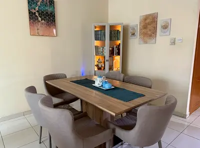 Wooden Dining Table with 6 Upholstered Chairs - Good Condition