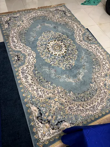 Light blue traditional Persian-style area rug - good condition