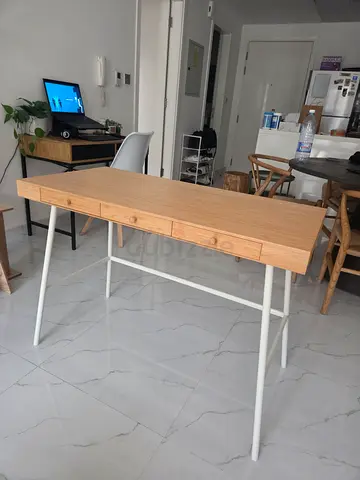 Light wood study desk with drawers and white metal legs