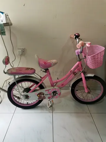 Pink girls' 16-inch bicycle with basket - good condition.
