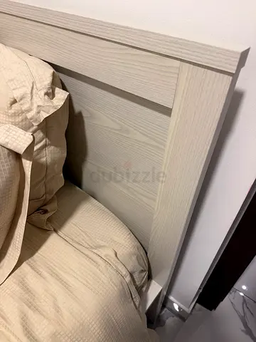 Single bed with mattress and sheets