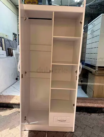 White Two Door Wardrobe with Shelves and Drawer