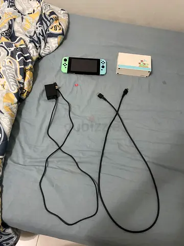 Selling used animal crossing Nintendo Switch Oled good condition with all wires and 128 gb micro sd