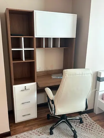 A desk in excellent condition with a large, spacious surface, providing plenty of room for comfortab
