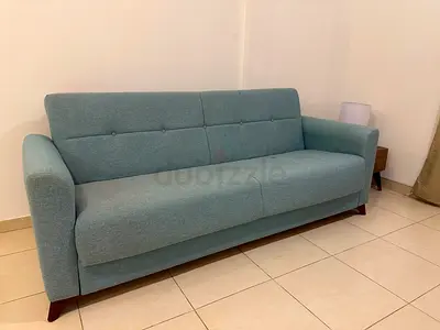 Light blue 3-seater fabric sofa in good condition