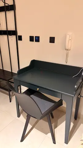 dark blue-green IKEA LOMMARP desk features a sleek writing desk with rotating chair