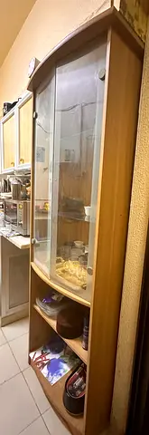 Tall wooden display cabinet with glass doors – good condition