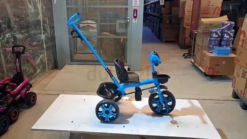 Blue kids tricycle with push handle and parent steering