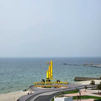 Two-bedroom apartment with a living room, fully furnished with new furniture, available for monthly rent in Ajman - Corniche - Residence Towers.