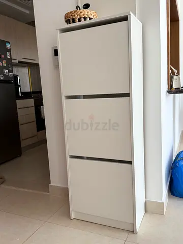 White Slim Shoe Cabinet with Drop-Down Compartments - Good Condition