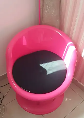 Pink Retro Plastic Swivel Accent Chair with Black Cushion