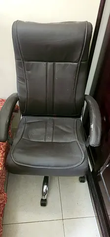 Used brown leather swivel office chair with armrests and wheels negoshible