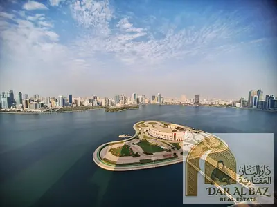 Beautiful two-bedroom apartment with a living room for annual rent in Al Majaz 3, Sharjah | 2 balconies with direct sea views | Private parking | Buil