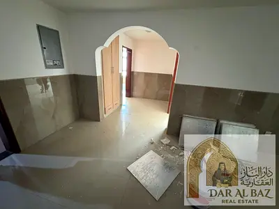 Apartment for annual rent in Al Butinah. The apartment has two bedrooms, a living room, and a maid's room. Both bedrooms are master suites. It has thr